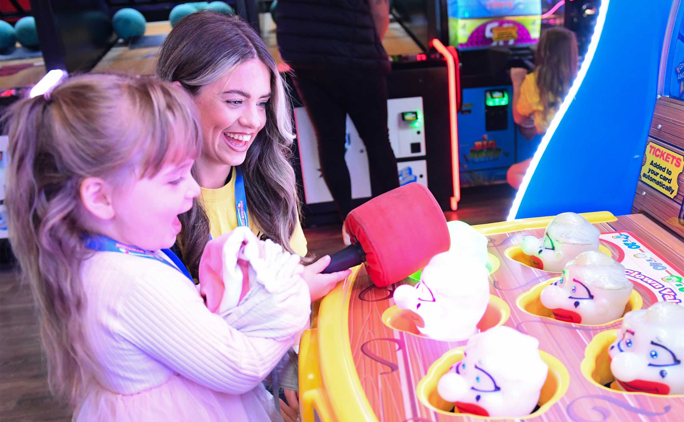 A young girl enjoying a funstation game in an arcade