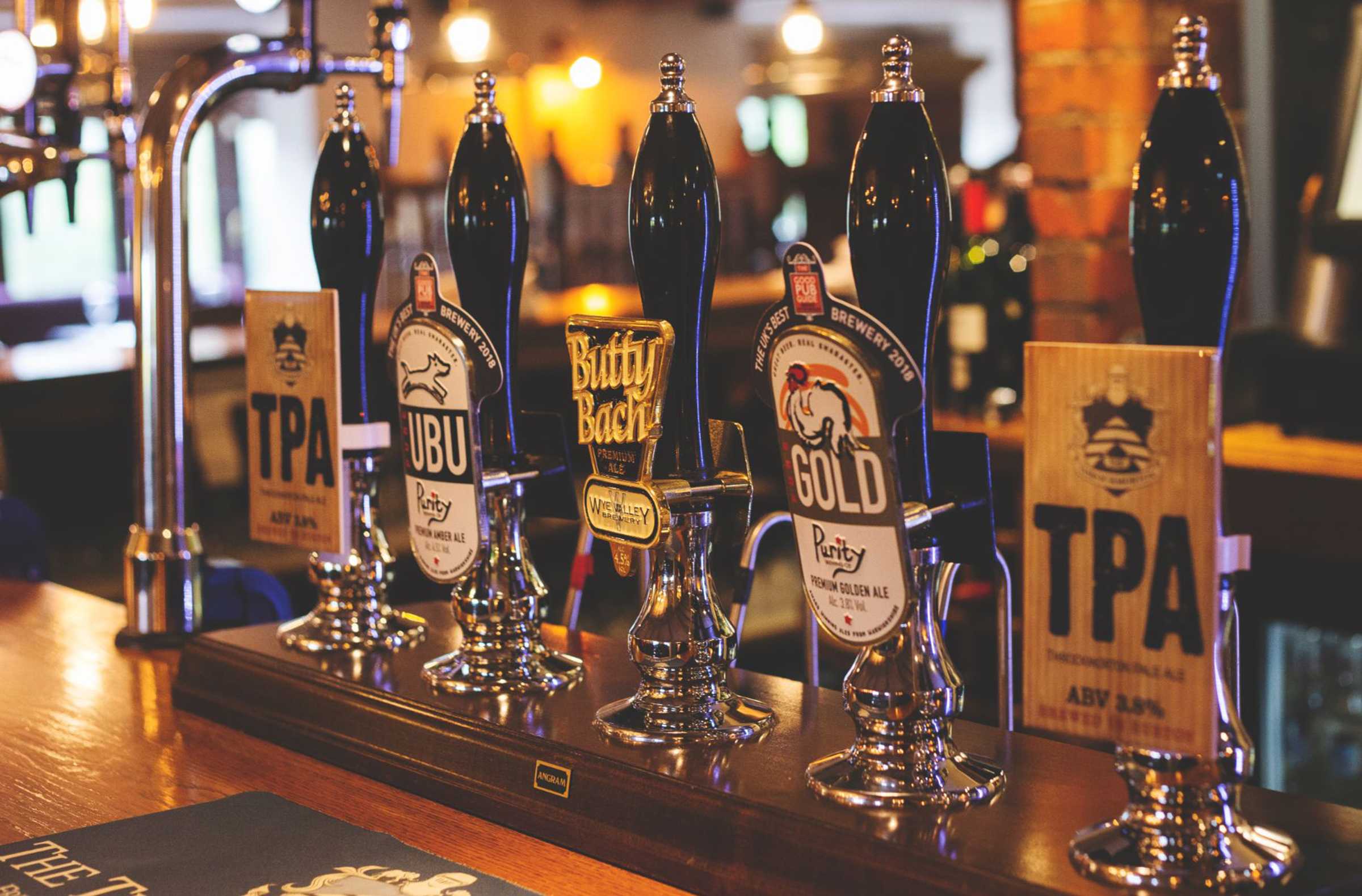 Pub bar with assortment of ale taps