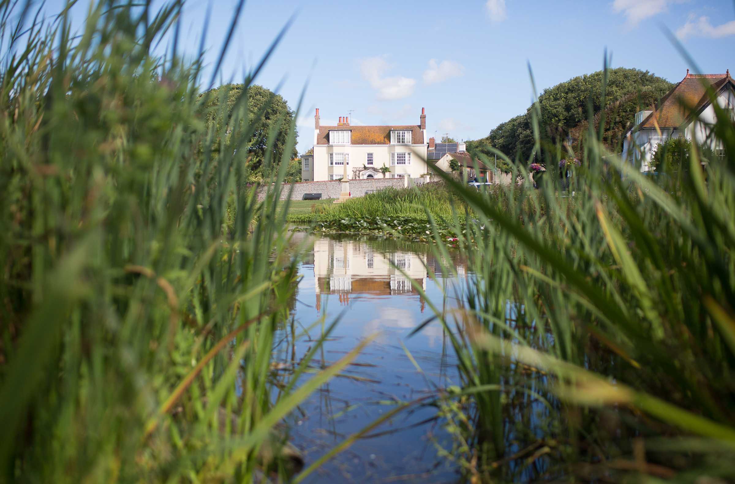 Picturesque view of a pub overlooking a lake