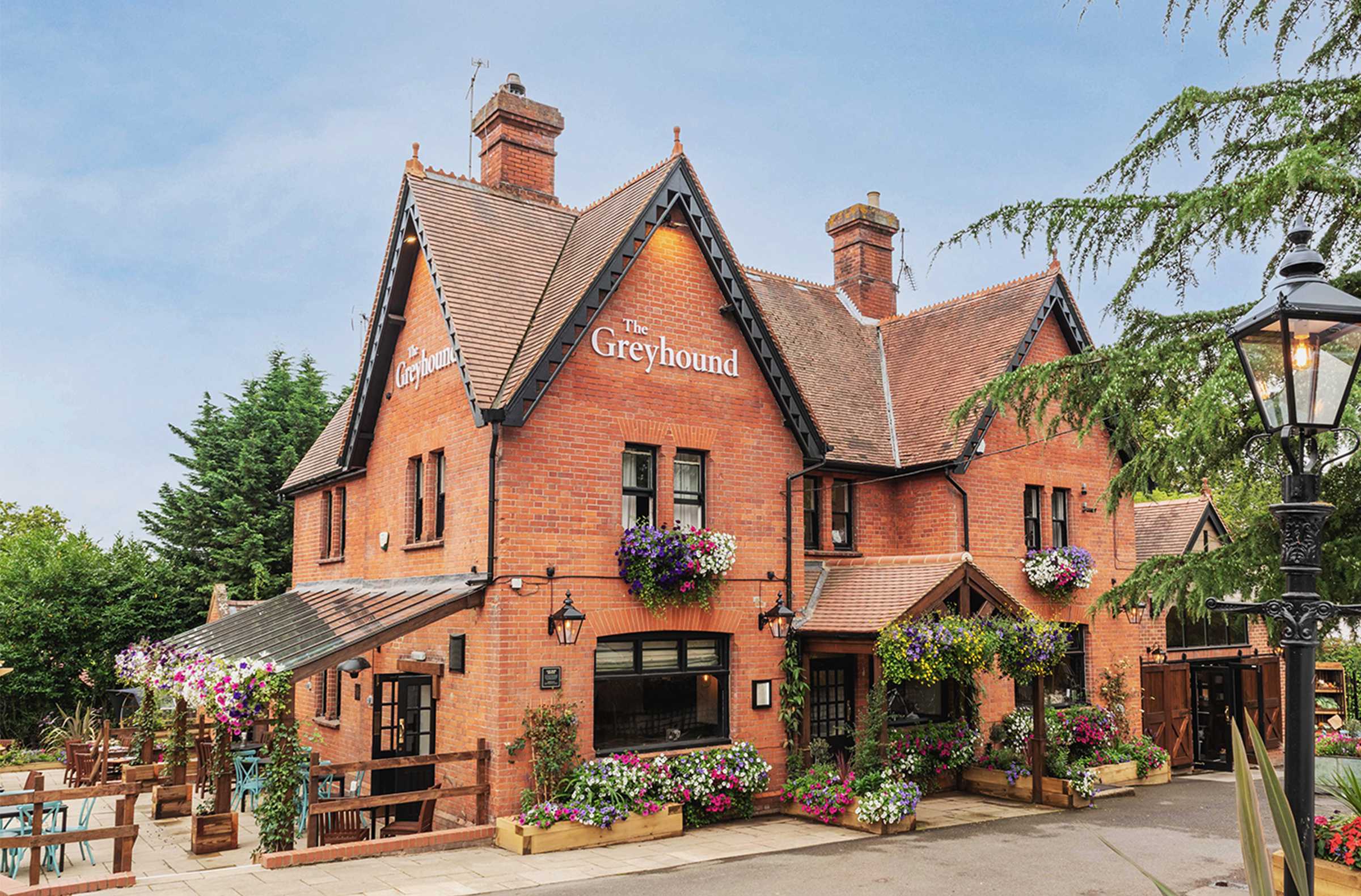 The Greyhound pub exterior with flowers